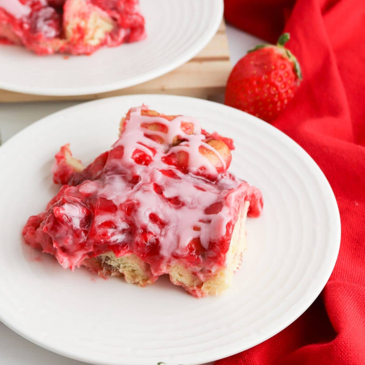 Strawberry Cinnamon Roll Casserole on a white plate