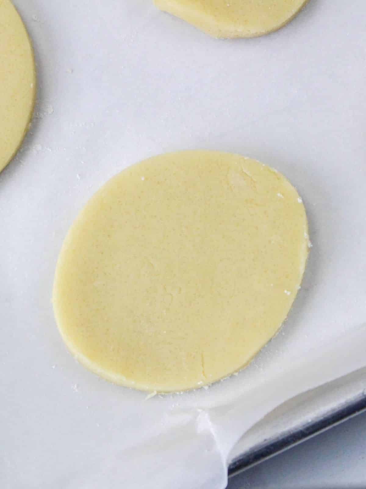 egg shaped cookie dough on baking tray.