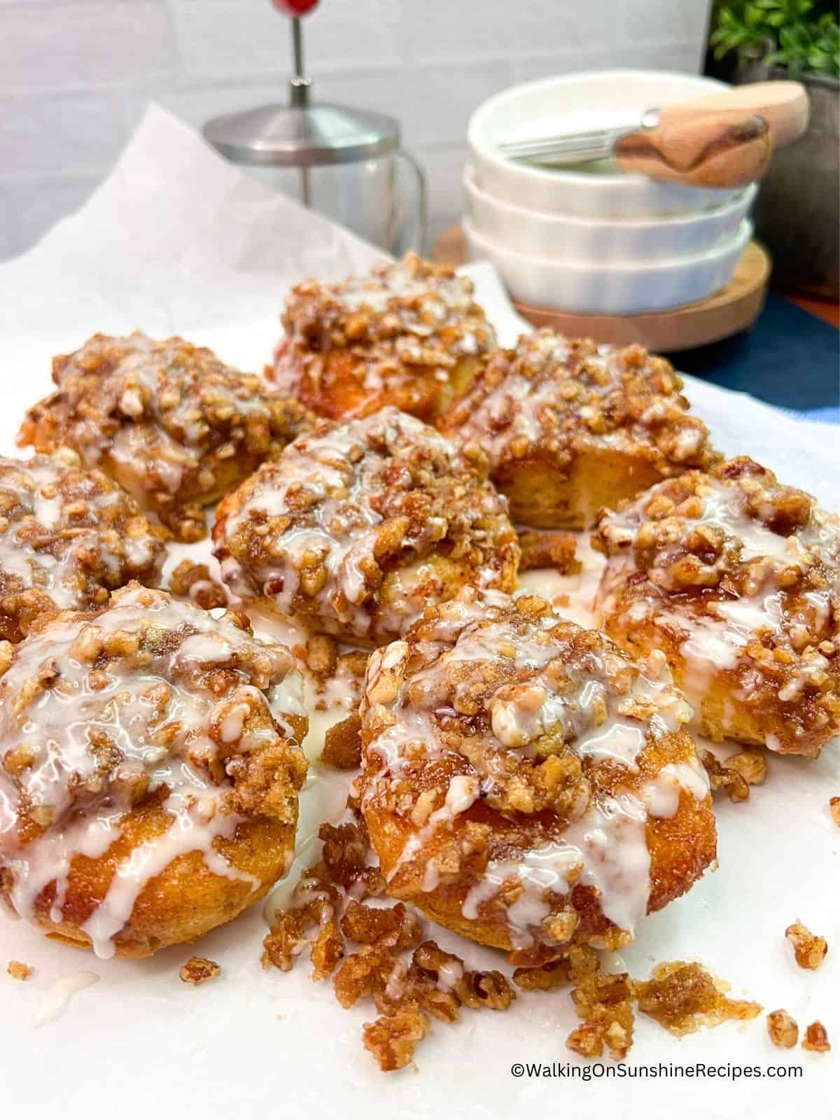 Pecan Rolls from Canned Cinnamon Rolls on white dish ready to serve.