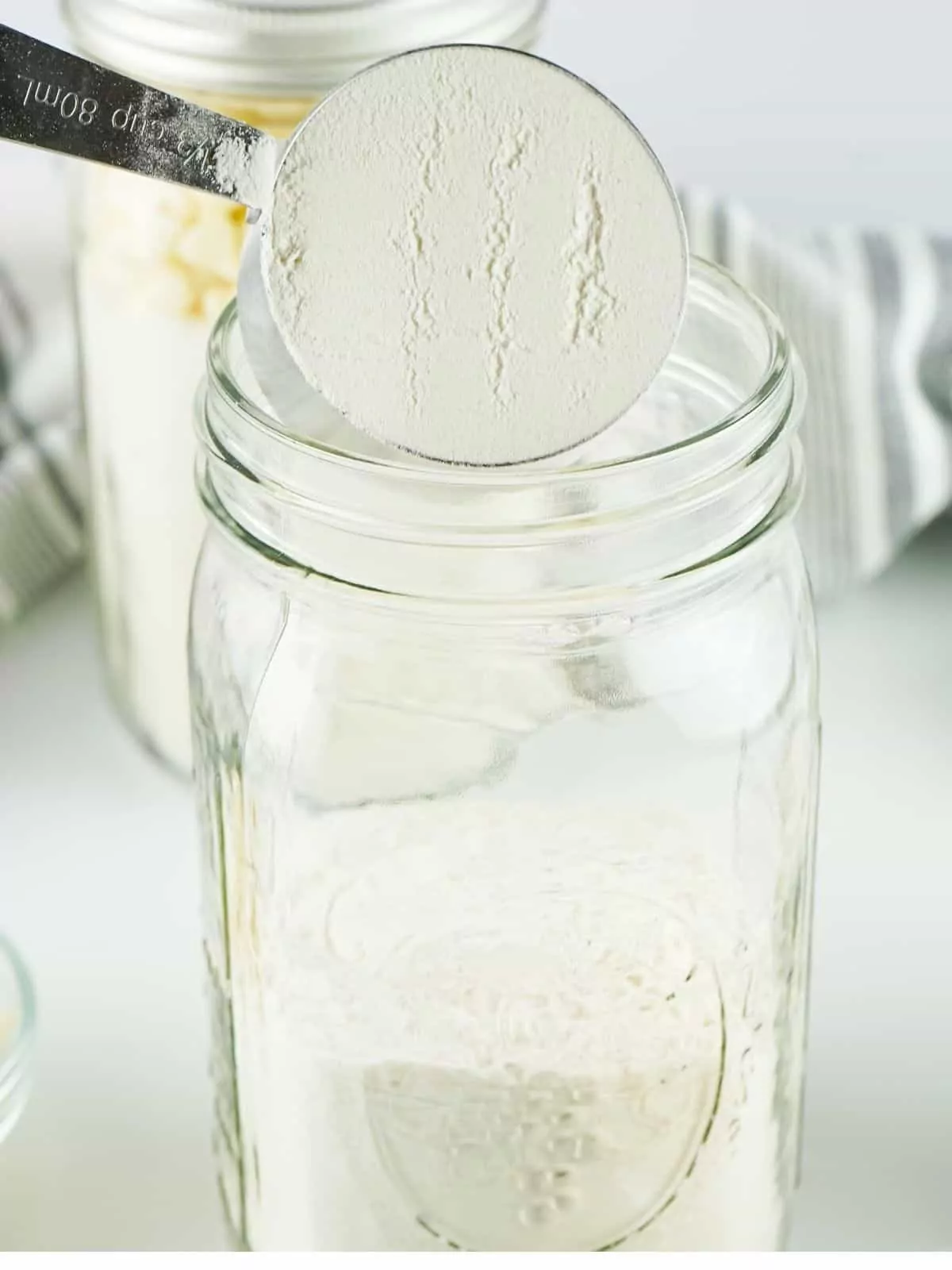 Add flour to mason jar.