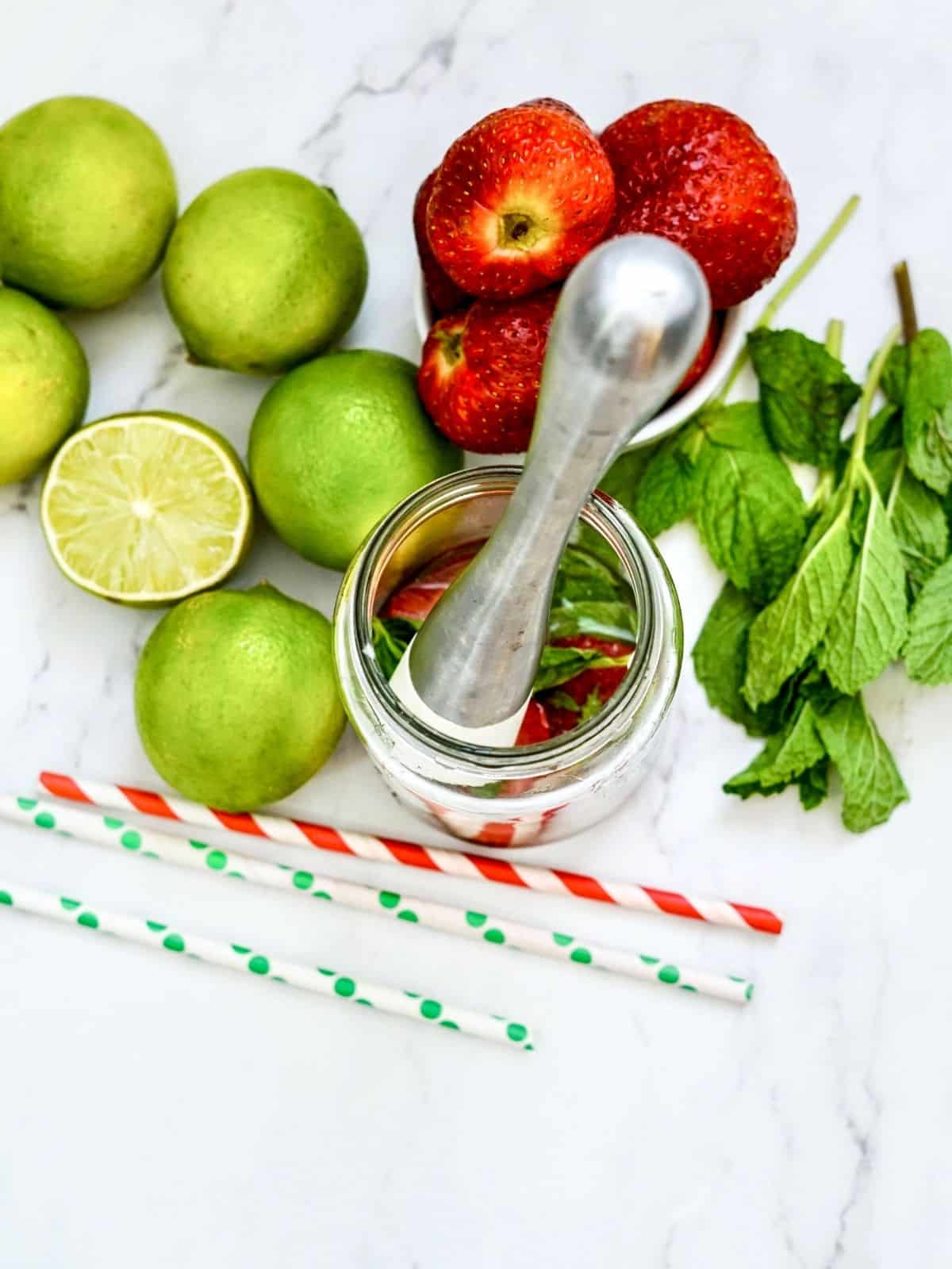 Add lime juice in glass with strawberries and mint.