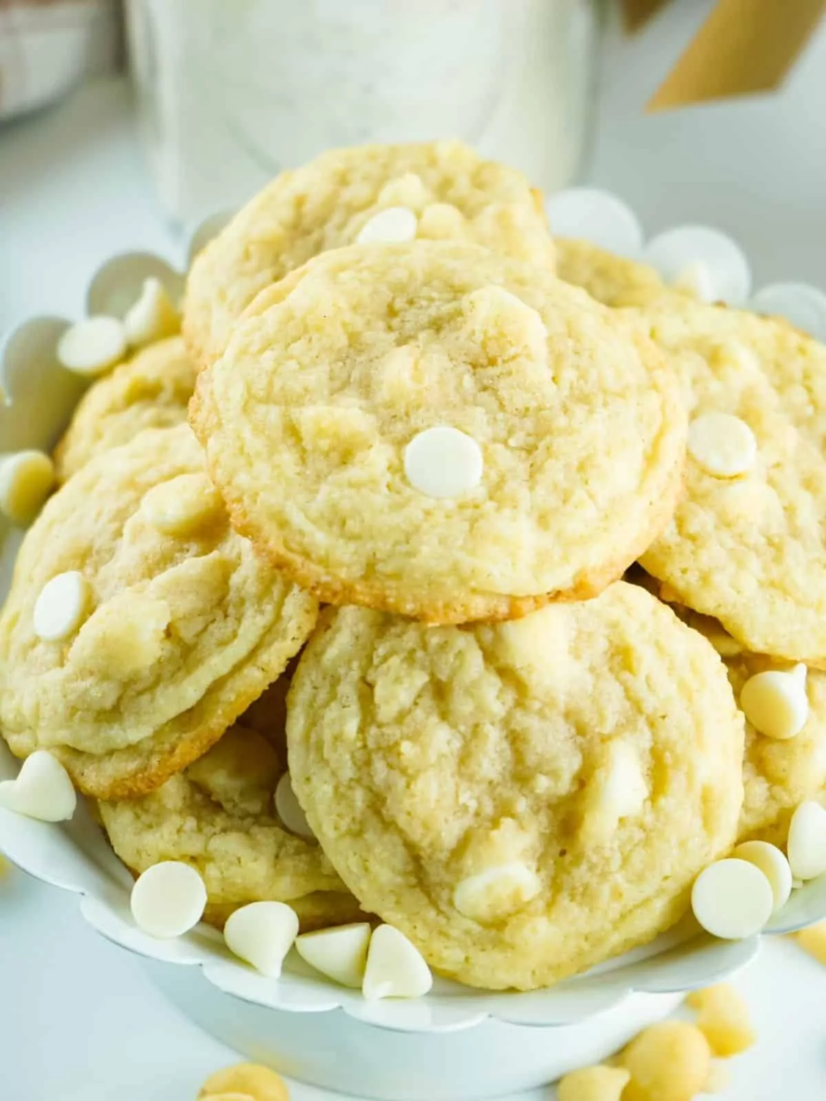 closeup of baked cookies with white chocolate chips and macadamia nuts.