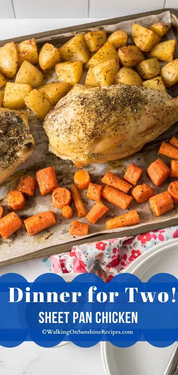 Roasted chicken breast, potatoes and carrots on a sheet pan ready to serve.