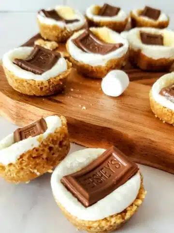 smores cookie cups with cutting board.