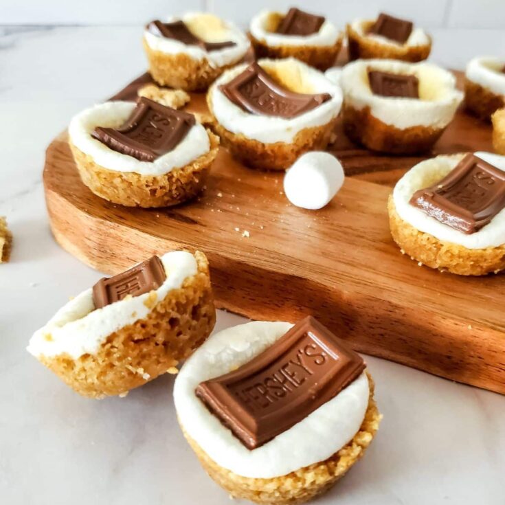 smores cookie cups with cutting board.