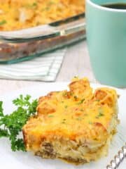 piece of breakfast casserole on plate with fork.