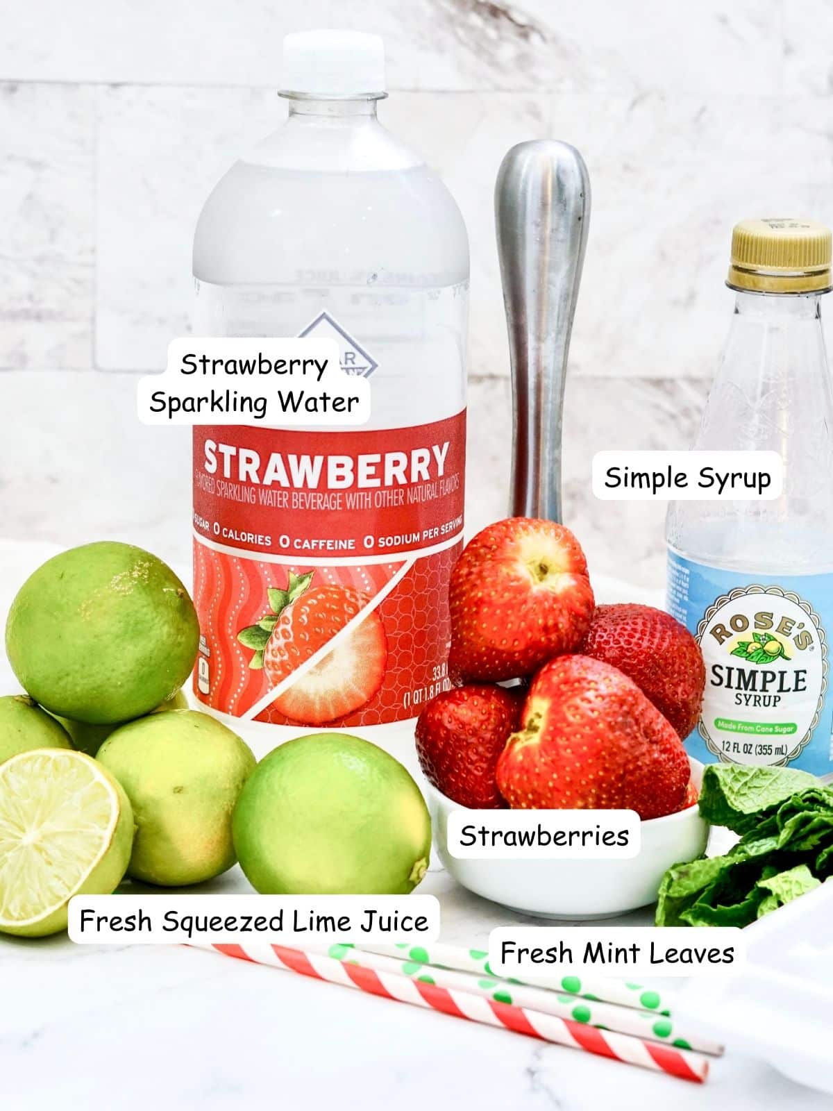 Ingredients sparkling water, limes, strawberries and fresh mint leaves.