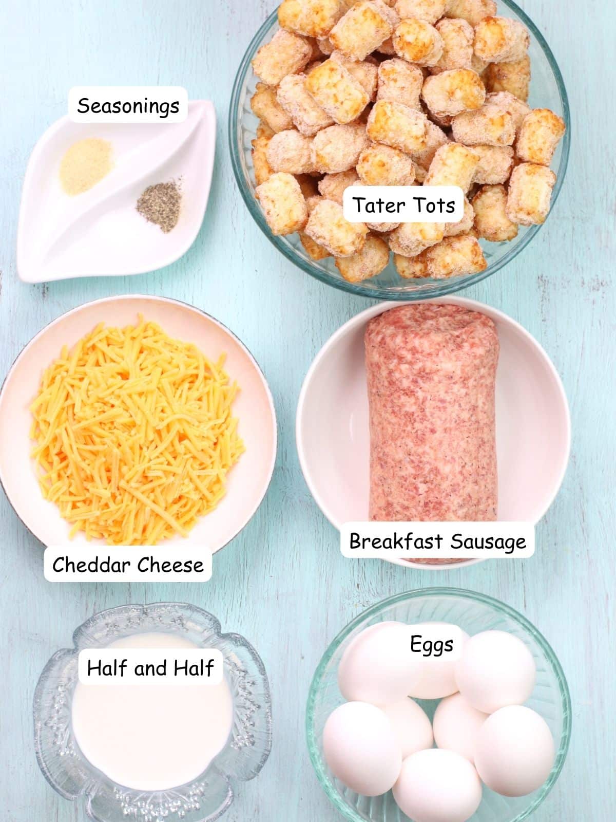 ingredients for breakfast casserole with eggs, sausage and tater tots.