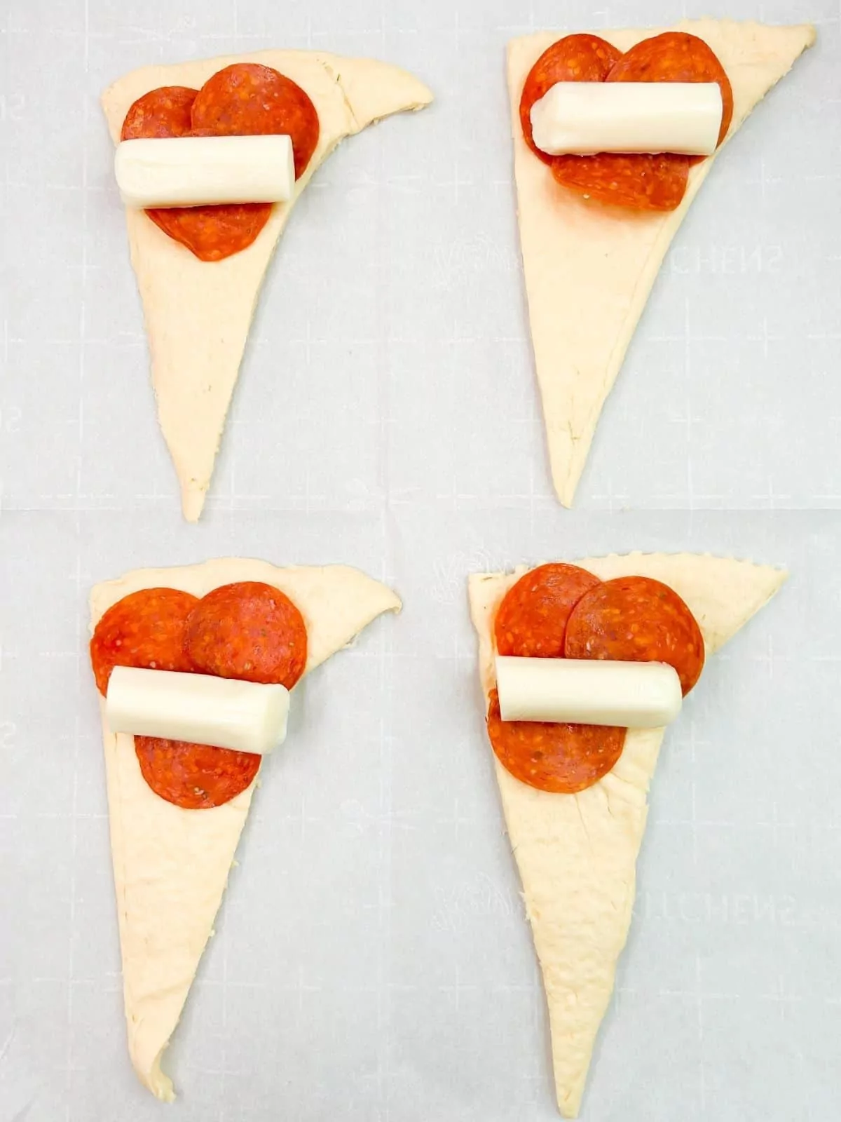 mozzarella cheese stick, pepperoni on top of crescent roll dough triangles.