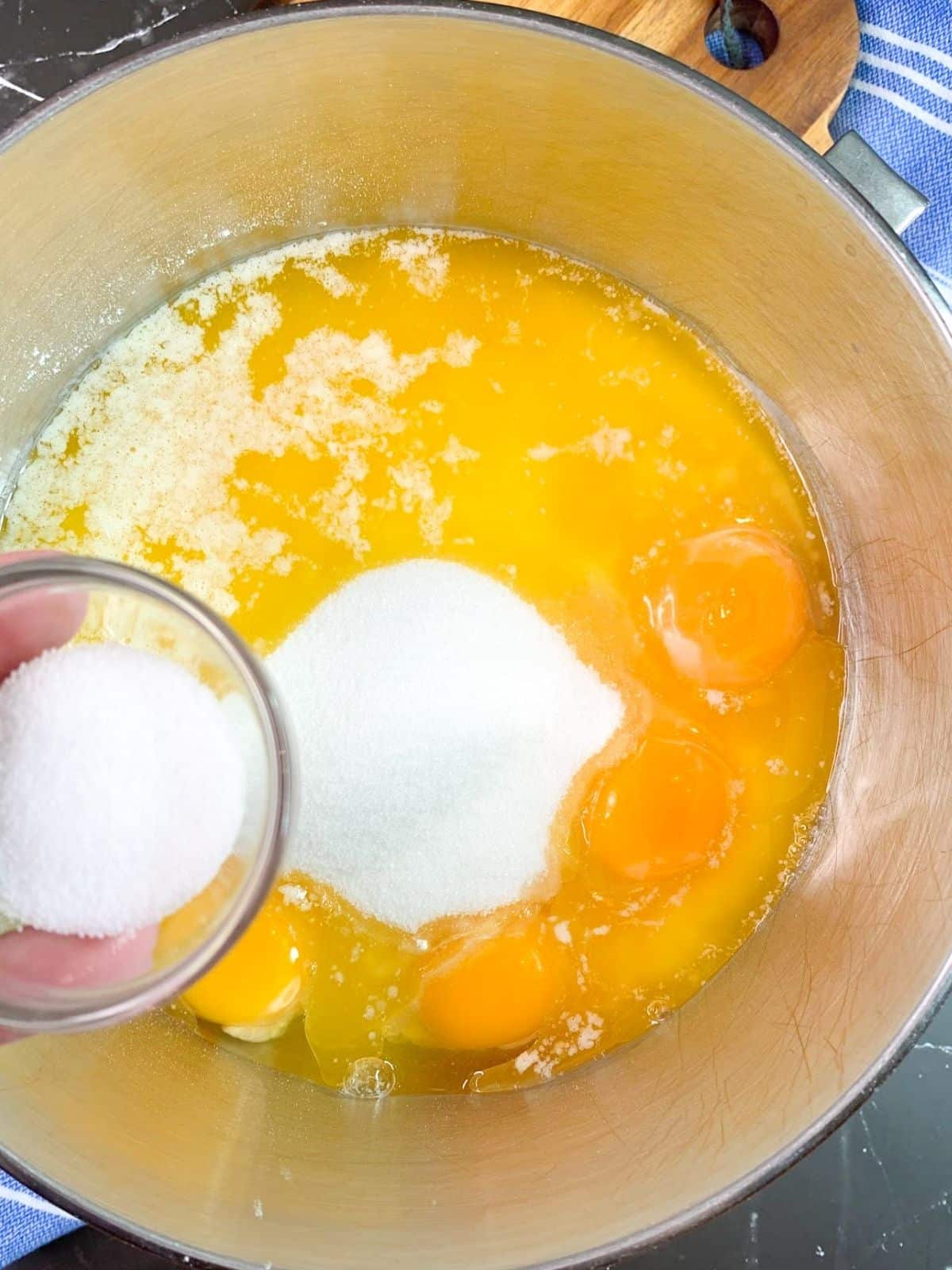 Add salt to egg mixture in mixing bowl.
