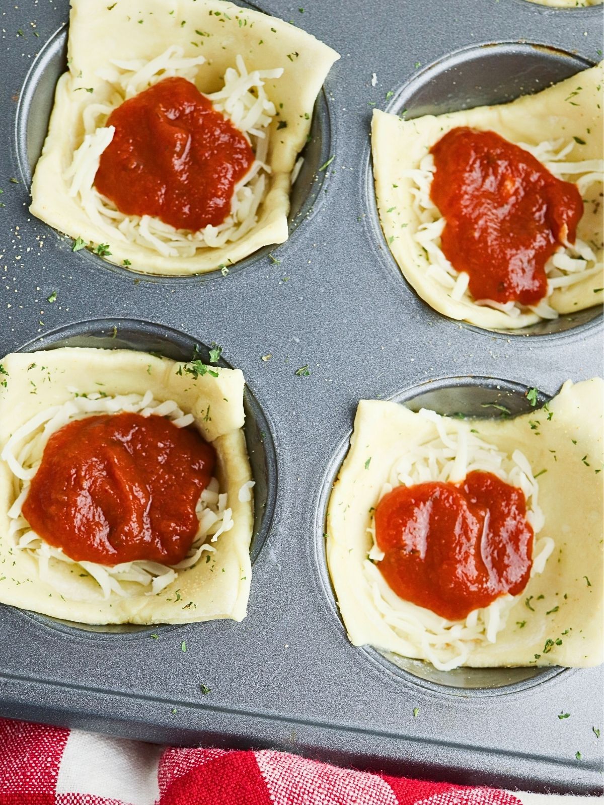 add sauce on top of cheese