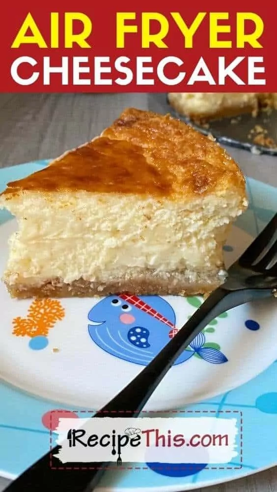 small piece of cheesecake on top of child's plate with blue fish.