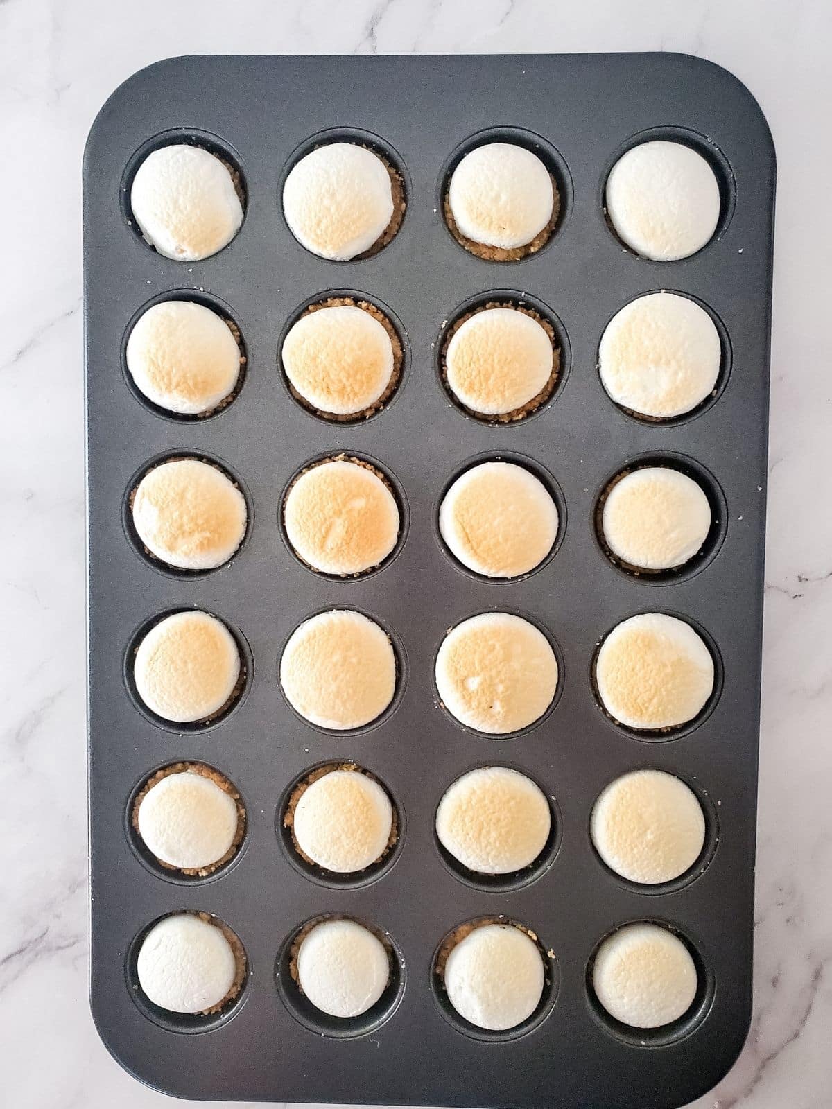 marshmallows roasted in oven in cupcake pan.