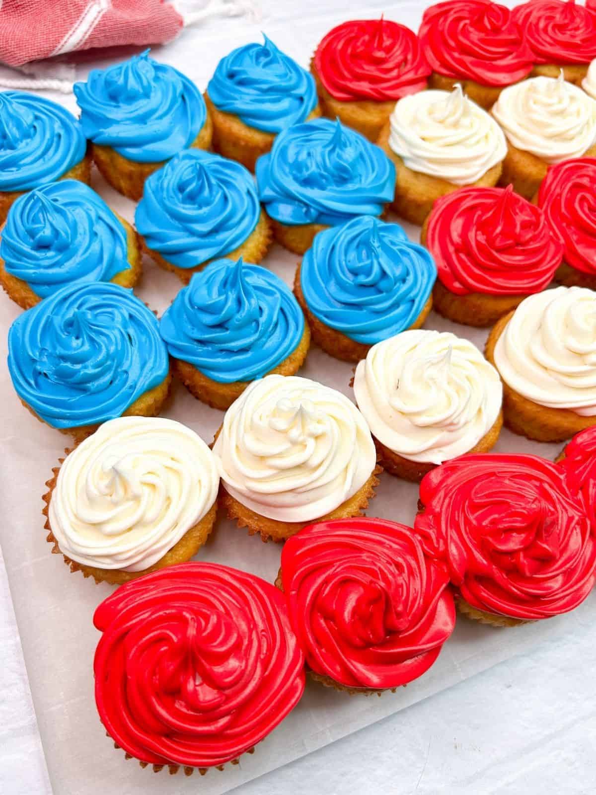 close up of red, white and blue cupcakes.