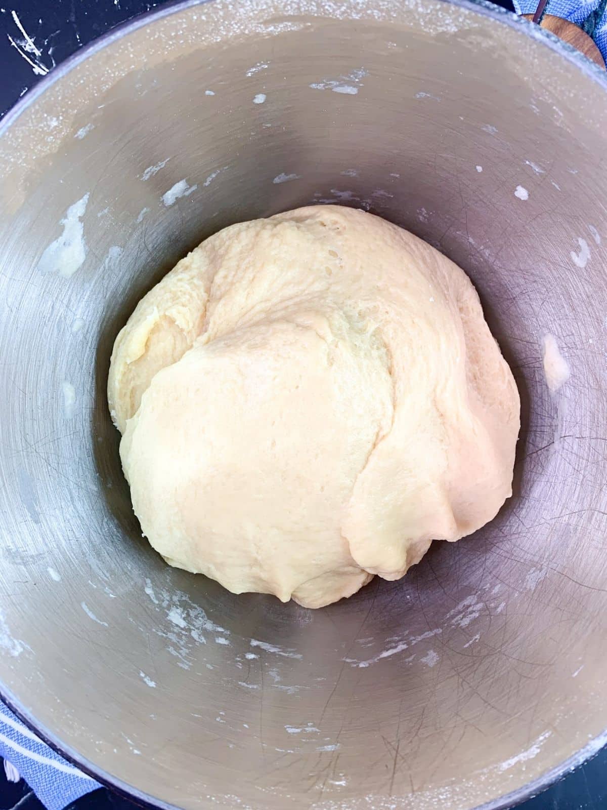 Bread dough before kneading in mixing bowl.