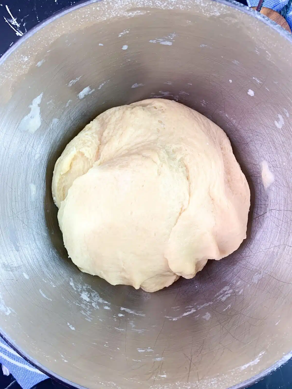 Bread dough before kneading in mixing bowl.