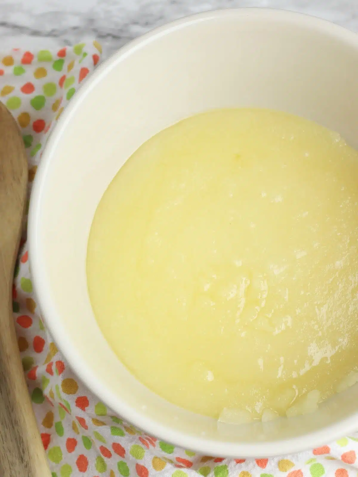 metled butter in white bowl.
