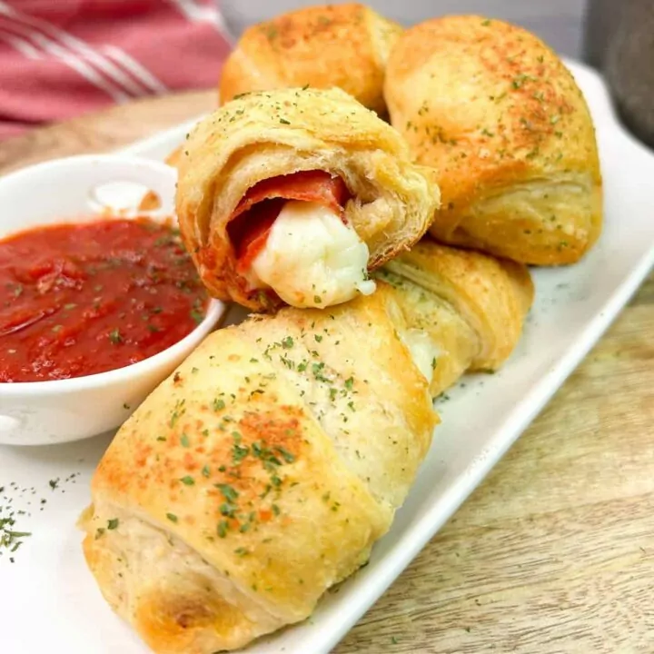 Crescent rolls stuffed and baked with pepperoni slices and cheese sticks.