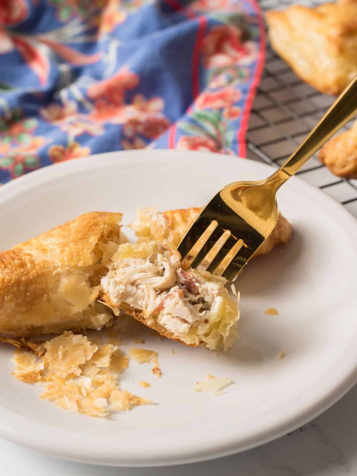 bite of puff pastry pocket on fork