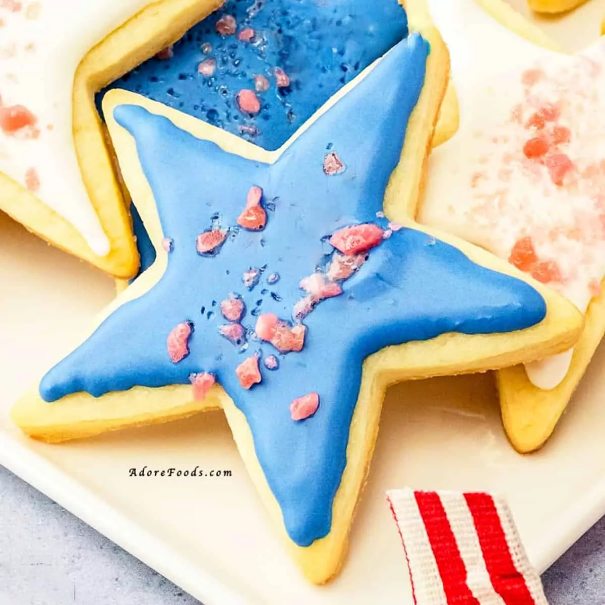 star shaped cookies decorated in patriotic colors.