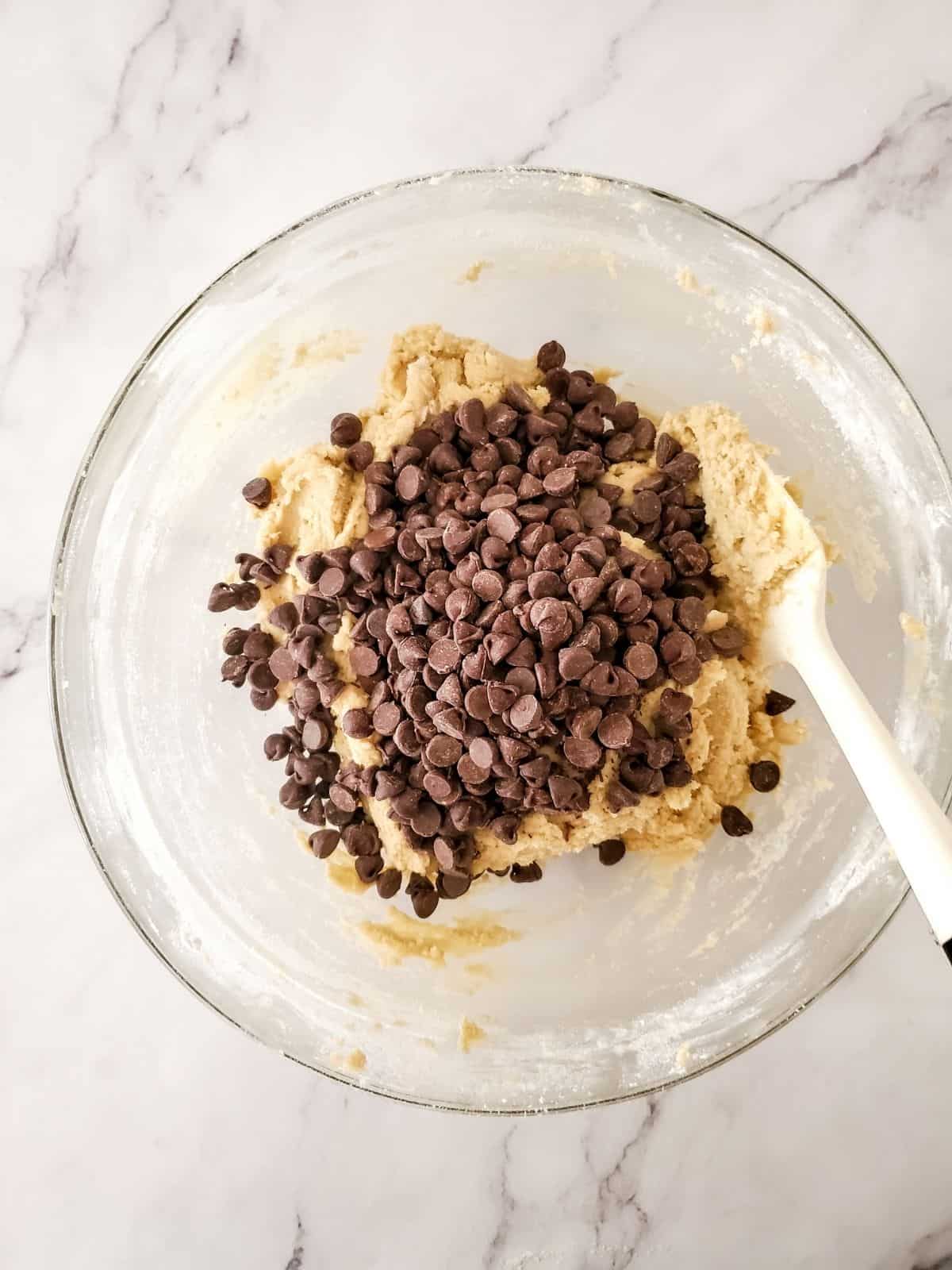 add chocolate chips to cookie batter.