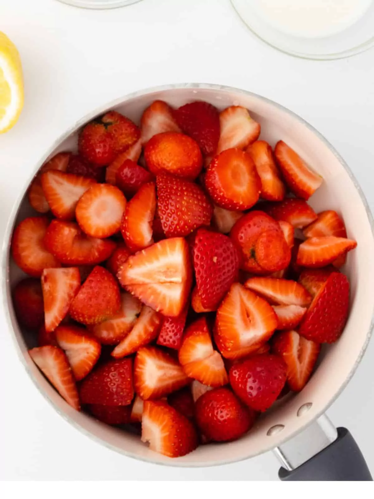 Add sliced strawberries to saucepan.