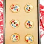 baked cookies on baking rack with parchment paper.