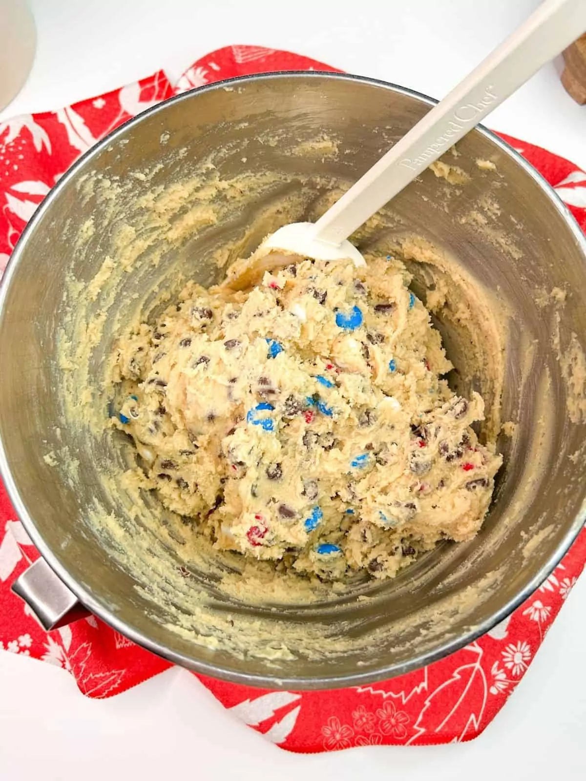 chocolate chip cookie dough in metal mixing bowl.