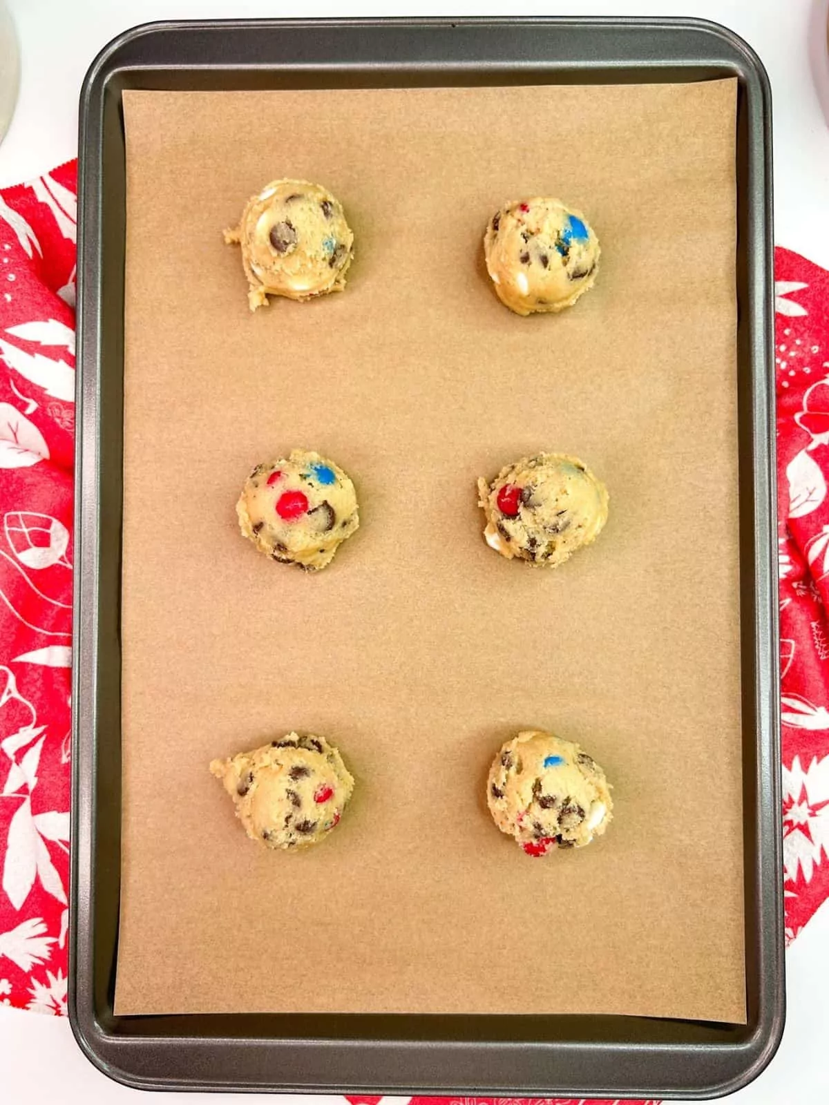 mounds of cookie dough on baking tray.