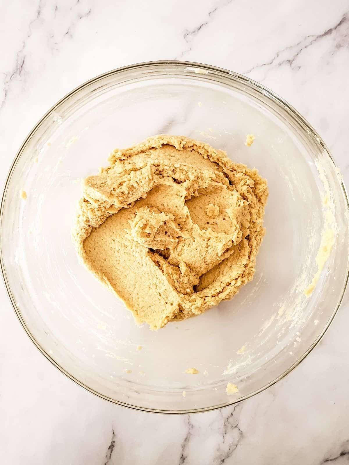 flour combined with wet ingredients for cookie batter.
