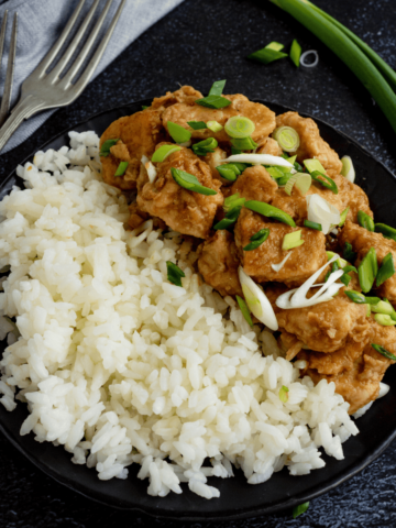 Orange chicken on plate with rice.