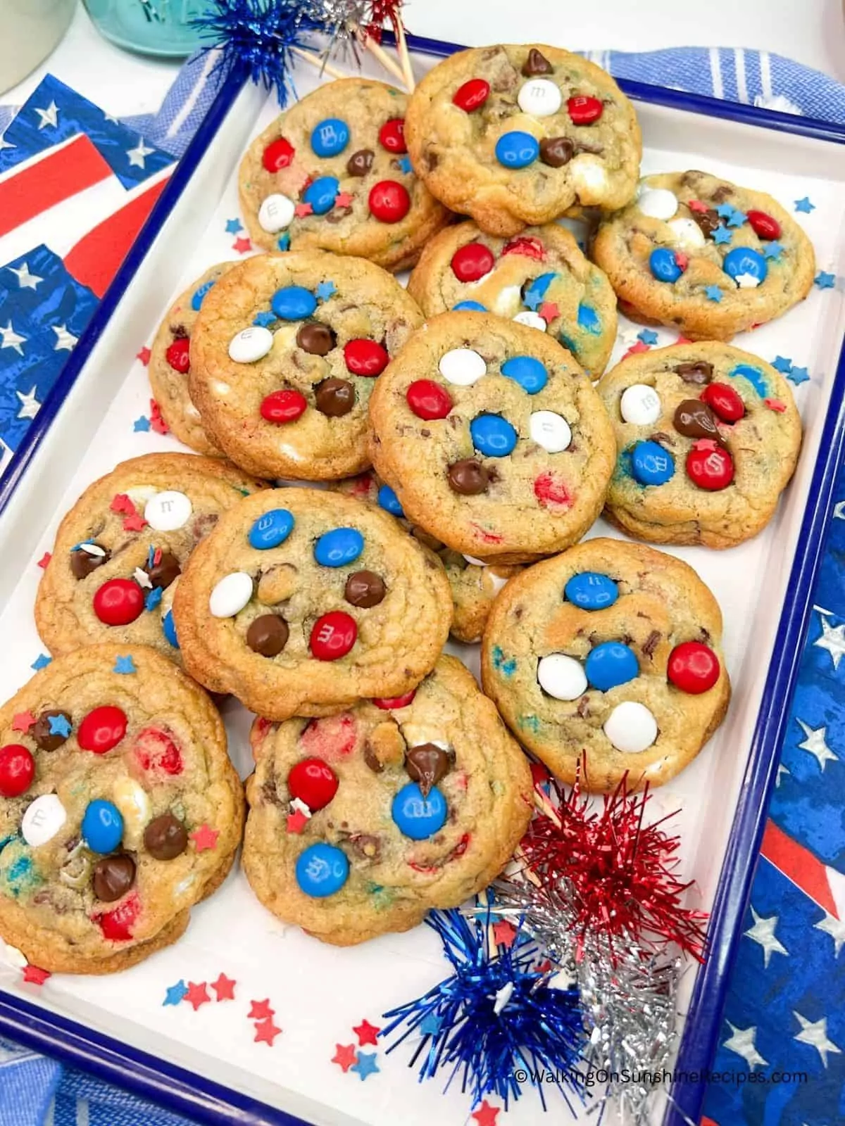 tray of chocolate chip cookies with red, white and blue candy pieces.