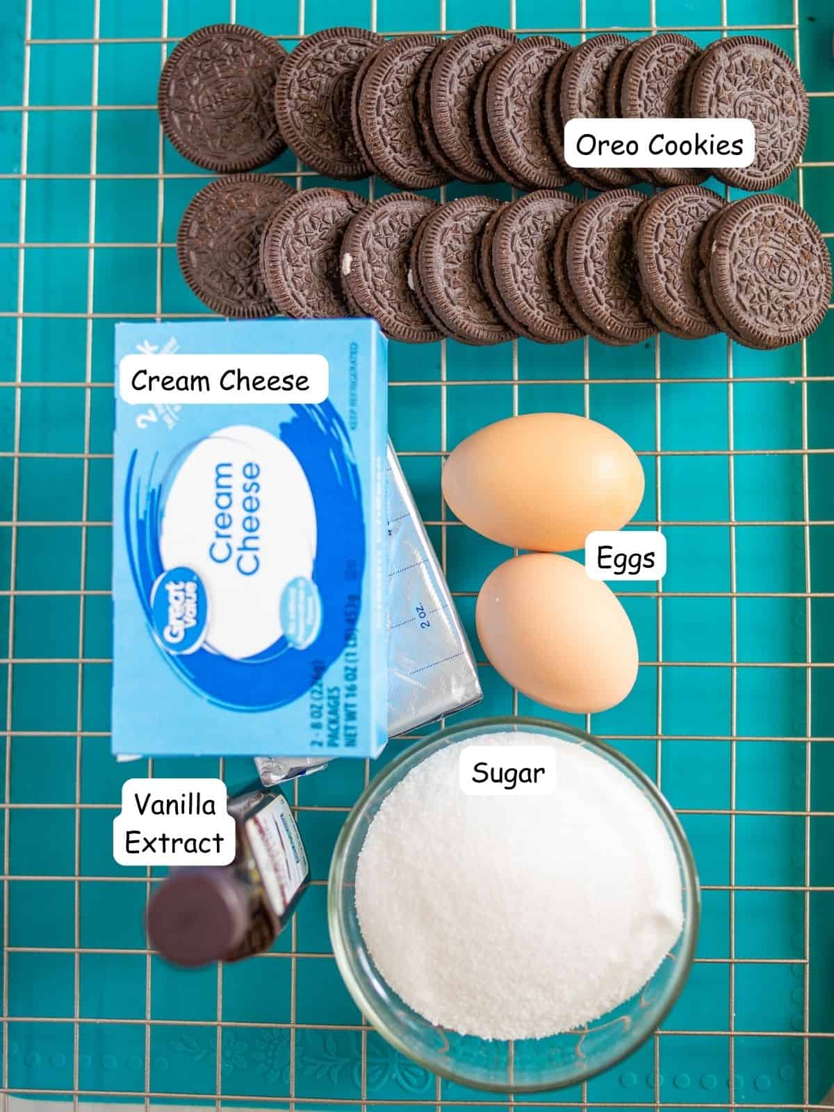 Ingredients for mini cheesecakes, cream cheese, Oreo cookies, sugar, eggs and vanilla extract.