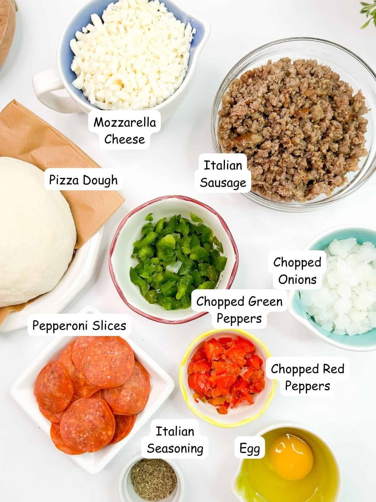Ingredients: Italian sausage, pepperoni, Italian sausage, red, green peppers, onions, pizza dough, mozzarella cheese.