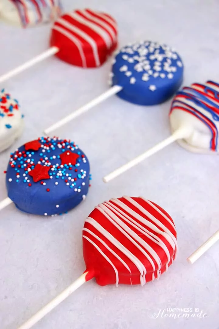 Oreo cookie pops decorated with patriotic colors.