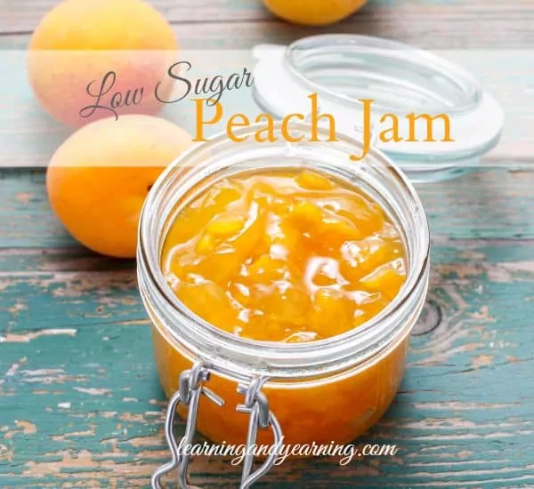 peach jam in small mason jar.