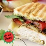 Grilled sandwich with chicken cutlet, pesto sauce, tomato and cheese Pinterest photo.