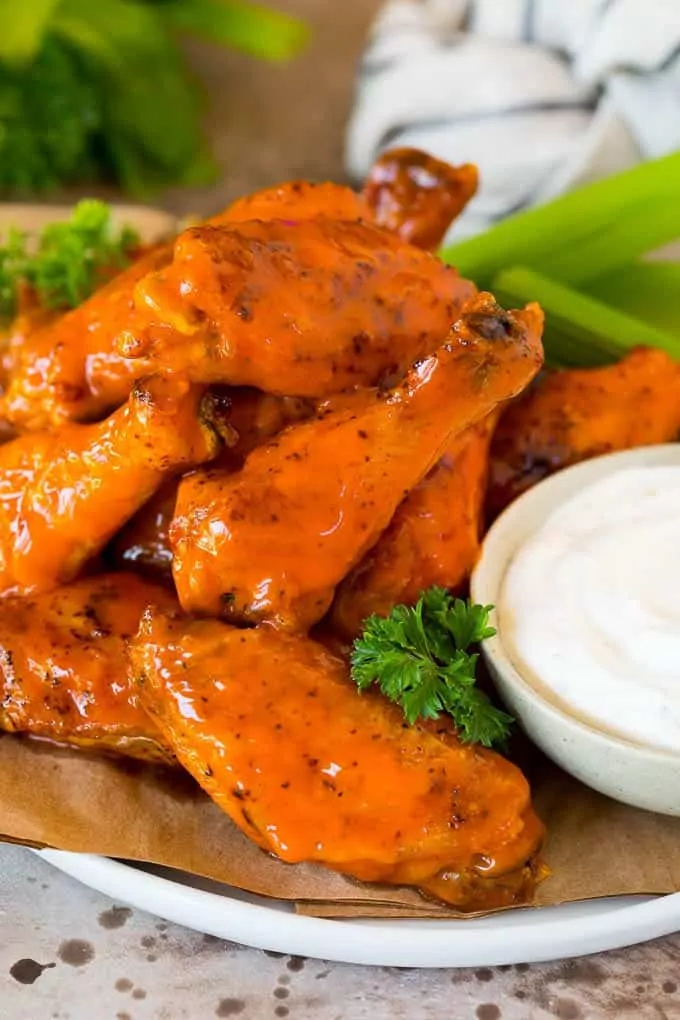 buffalo sauce wings with bowl of ranch dressing.