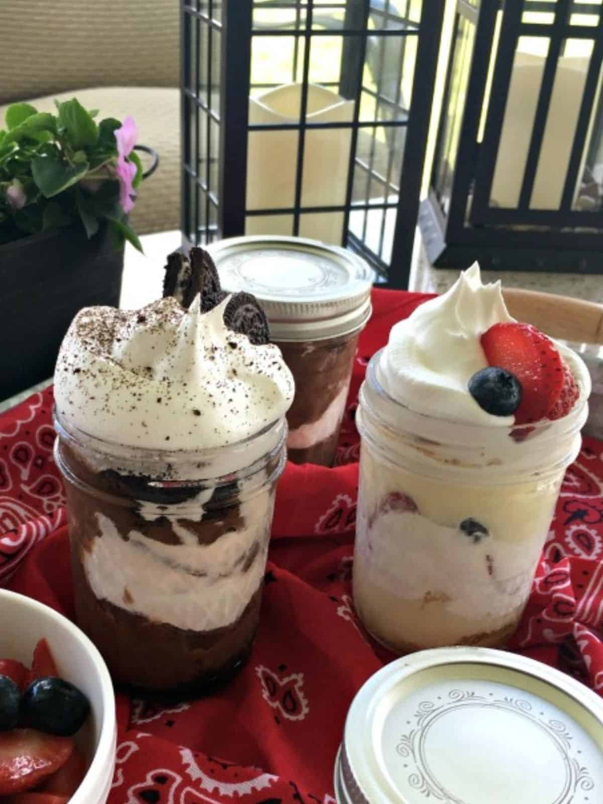 chocolate and vanilla pudding parfaits on tray with red bandana.