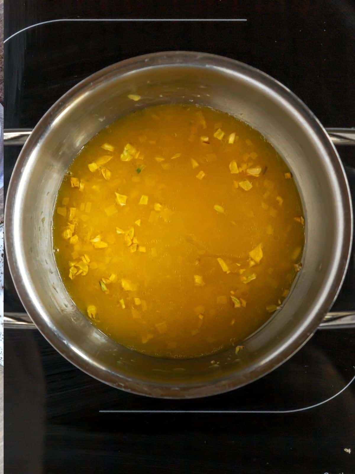 orange garlic sauce cooking.