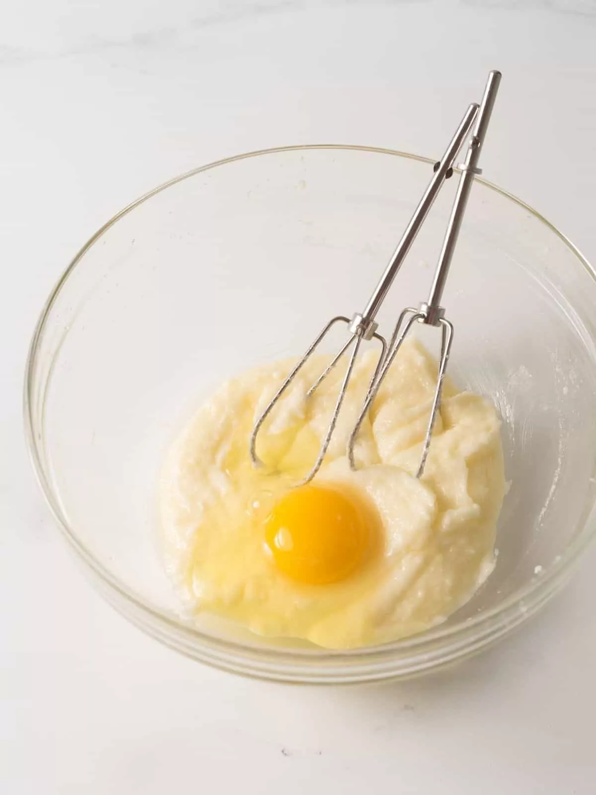 add eggs to butter sugar mixture with mixer beaters in bowl.