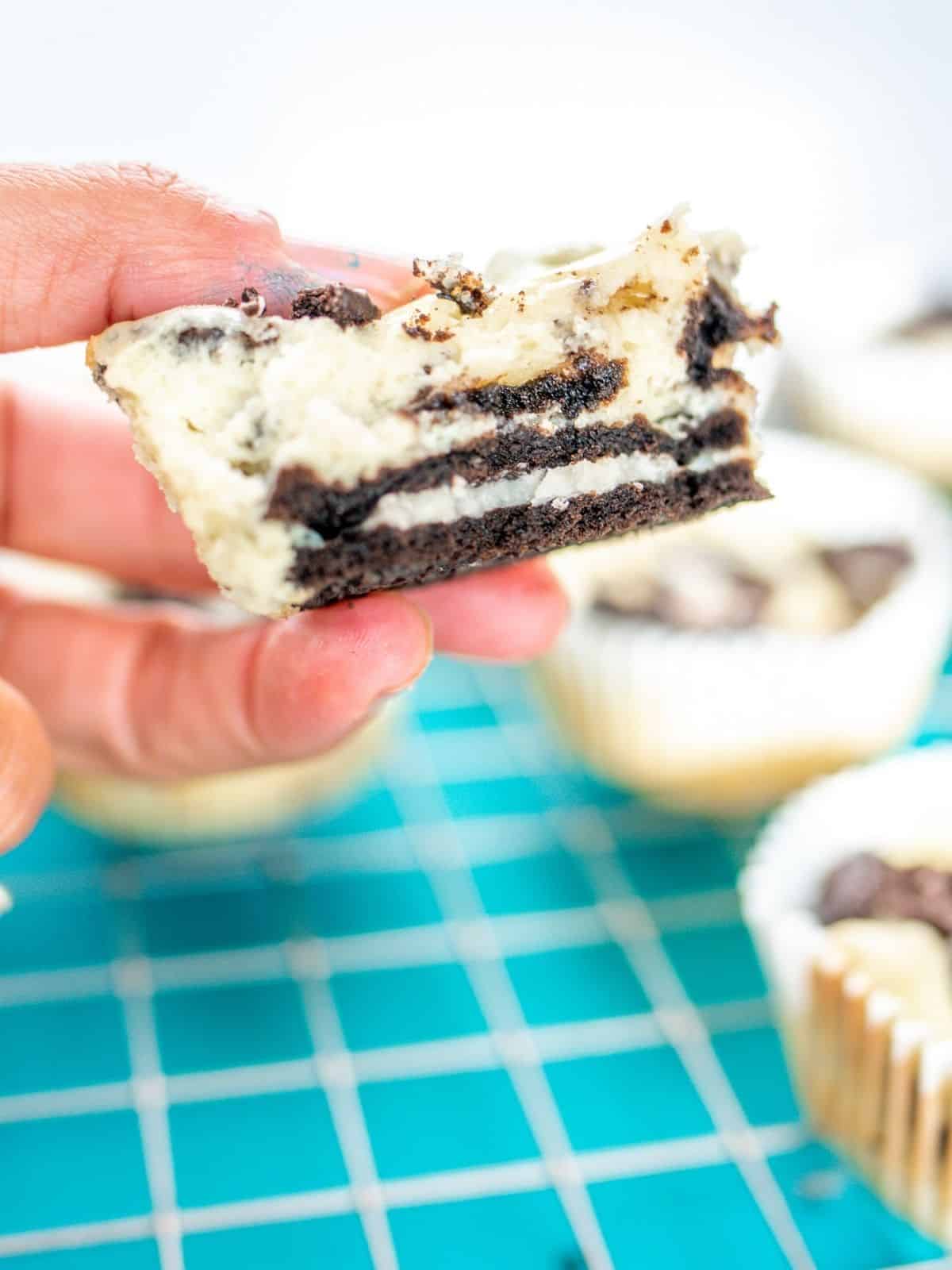 Inside view of Oreo Cheesecake being held in hand.