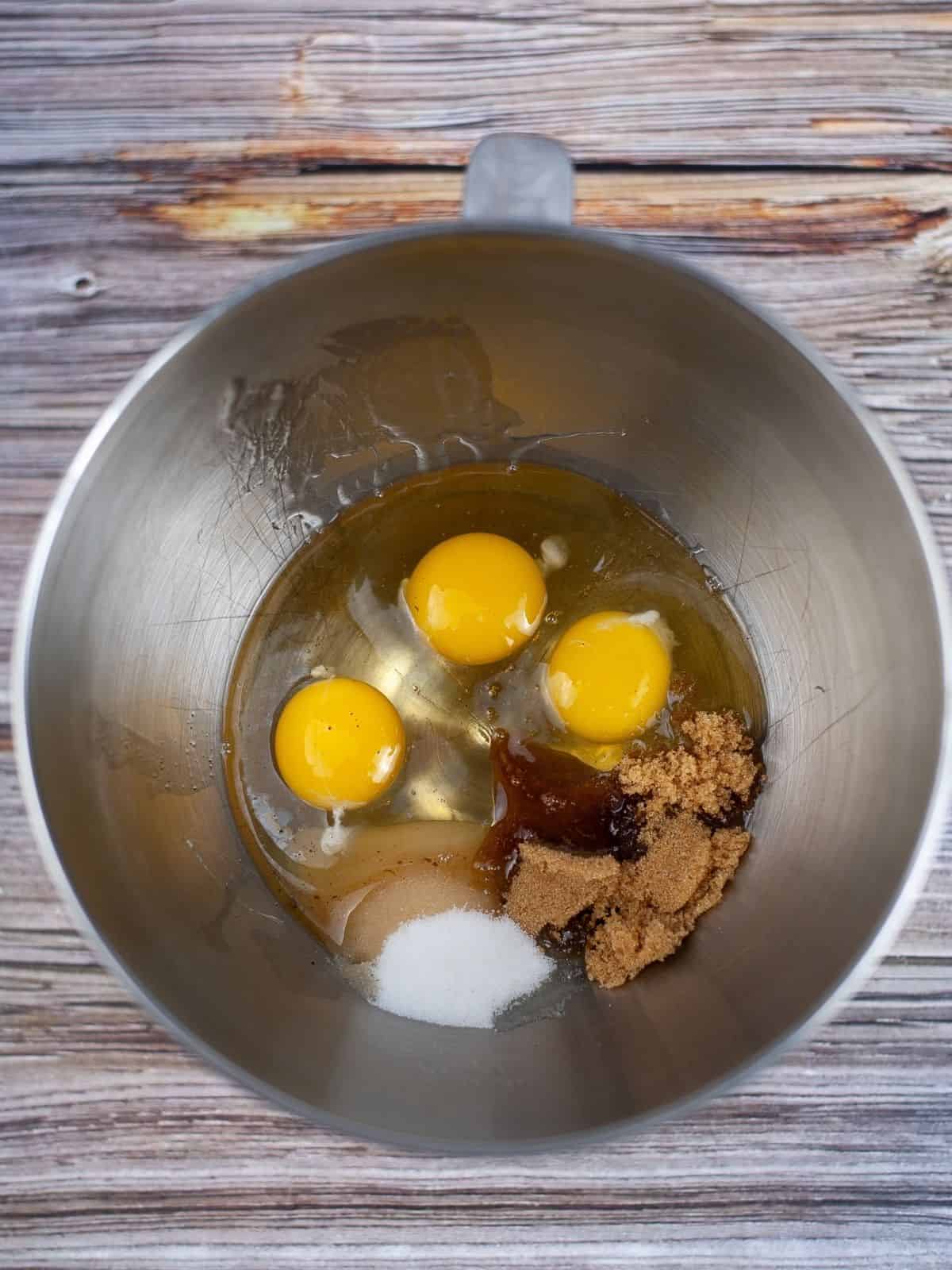 eggs, brown and granulated sugar, vanilla extract in mixing bowl.