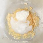 Add Greek yogurt with melted coconut oil to butter and sugar mixture.