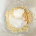 Add Greek yogurt with melted coconut oil to butter and sugar mixture.