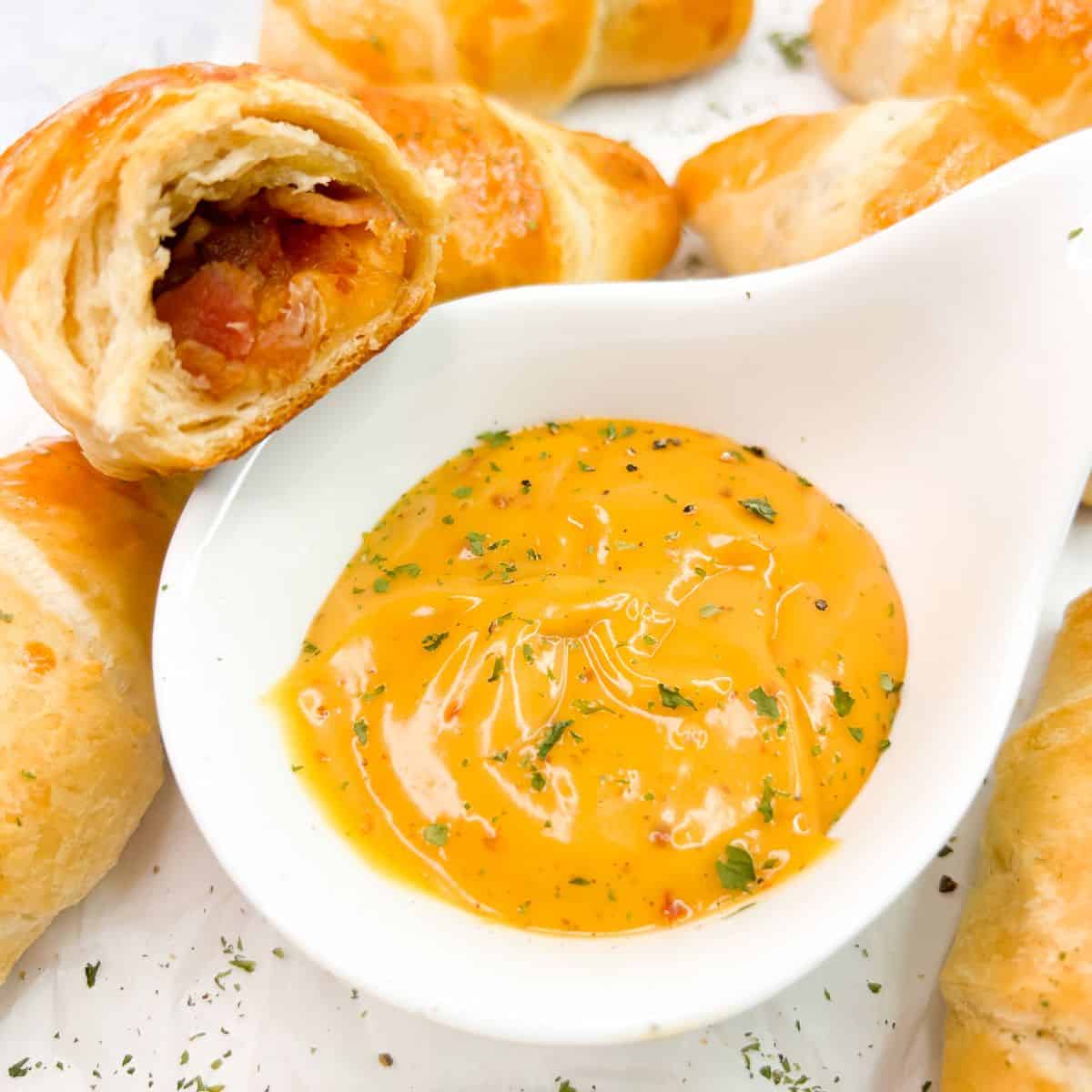closeup of crescent roll filled with bacon and cheese.