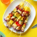 Grilled chicken with pineapple chunks and vegetables.