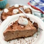 slice of chocolate cheesecake pudding pie served on a white plate.