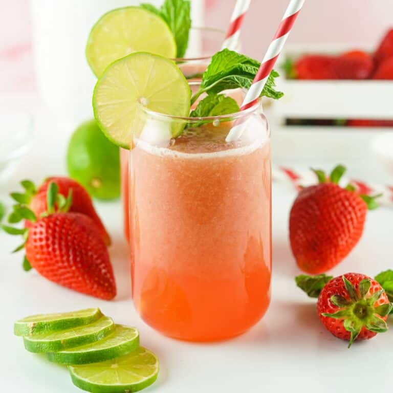 two glasses filled with strawberry water.