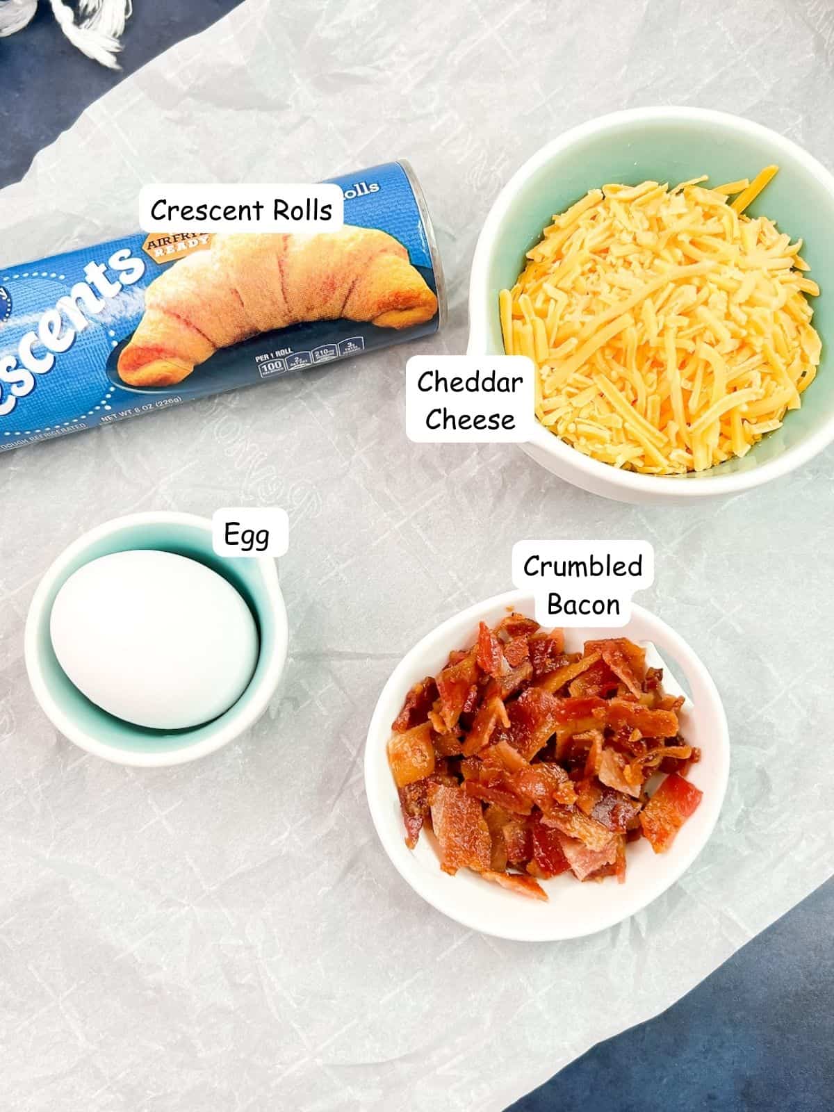 ingredients crescent rolls, crumbled bacon, cheddar cheese and egg.